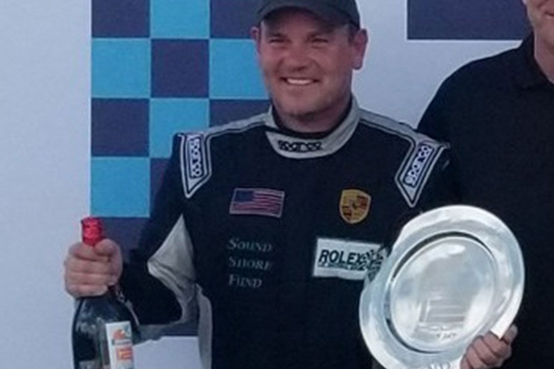 Mayo on the podium at the Rolex 24 in Daytona.
