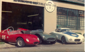 Automotive Restorations Inc with cars out front.